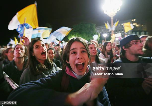 Argentinians gather in Plaza de Mayo while watching a live broadcast of the installation of Pope Francis in Saint Peter's Square on March 19, 2013 in...