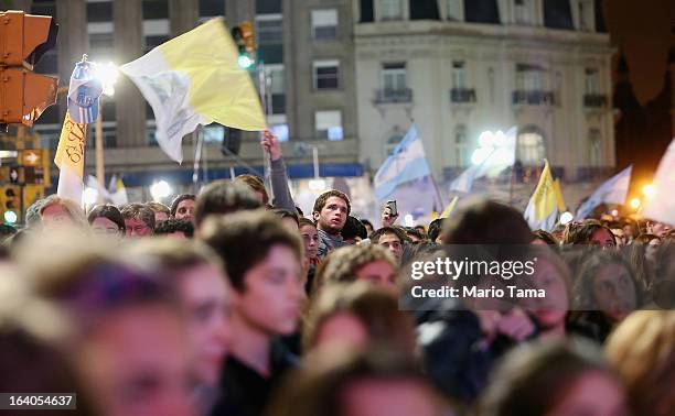 Argentinians gather in Plaza de Mayo while watching a live broadcast of the installation of Pope Francis in Saint Peter's Square on March 19, 2013 in...