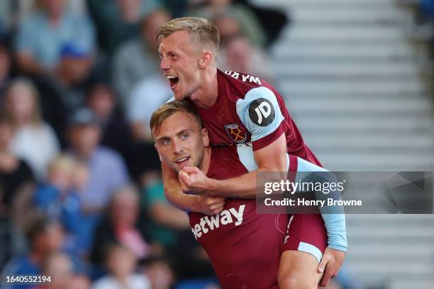 Jarrod Bowen of West Ham United celebrates with James Ward-Prowse of West Ham United after scoring the team's second goal during the Premier League...