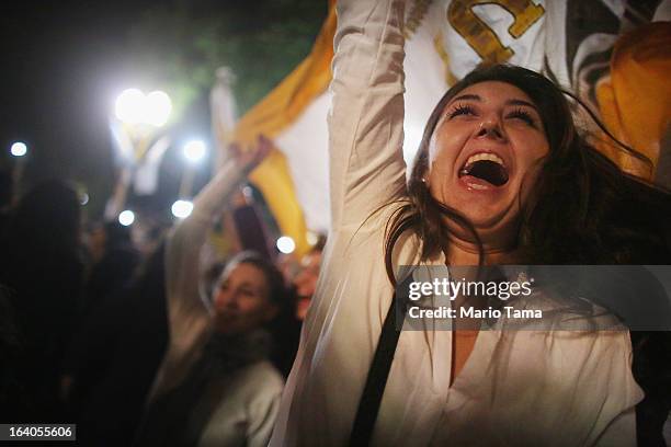 Argentinians celebrate at a vigil for Pope Francis outside the Metropolitan Cathedral in Plaza de Mayo on March 18, 2013 in Buenos Aires, Argentina....