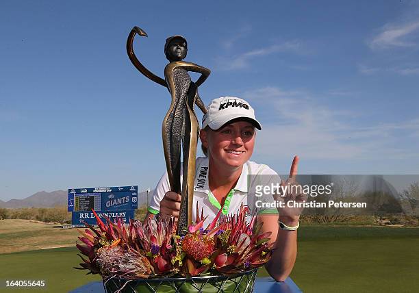 Stacy Lewis poses with the trophy after winning the the RR Donnelley LPGA Founders Cup and becoming number 1 in the World Golf Ranking at Wildfire...