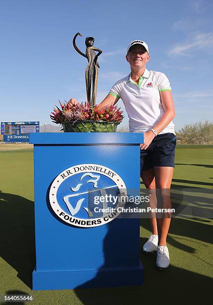 Stacy Lewis poses with the trophy after winning the the RR Donnelley LPGA Founders Cup at Wildfire Golf Club on March 17, 2013 in Phoenix, Arizona.