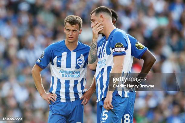 Solly March and Lewis Dunk of Brighton & Hove Albion discuss a free-kick before taking it during the Premier League match between Brighton & Hove...