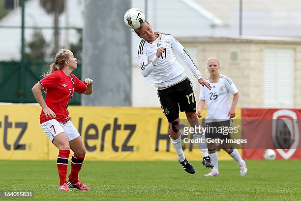Lene Mykjaland of Norway challenges Viola Odebrecht of Germany during the Algarve Cup 2013 match between Norway and Germany at the Estadio Municipal...