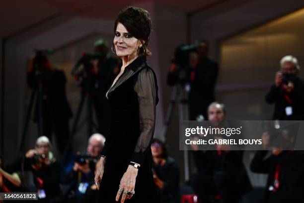 French actress Fanny Ardant poses during the red carpet of the movie 'The Palace' presented out of competition at the 80th Venice Film Festival on...