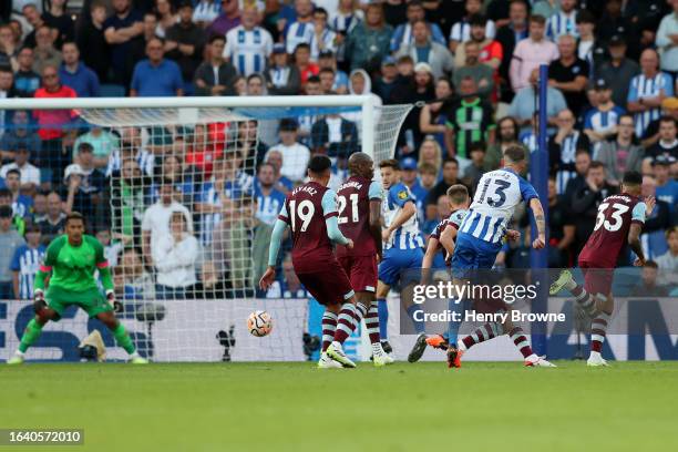 Pascal Gross of Brighton & Hove Albion scores the team's first goal during the Premier League match between Brighton & Hove Albion and West Ham...