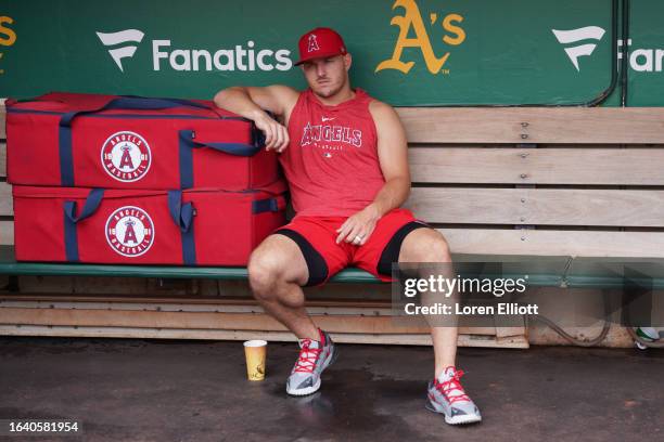 Mike Trout of the Los Angeles Angels looks on from the dugout prior to the game between the Los Angeles Angels and the Oakland Athletics at...