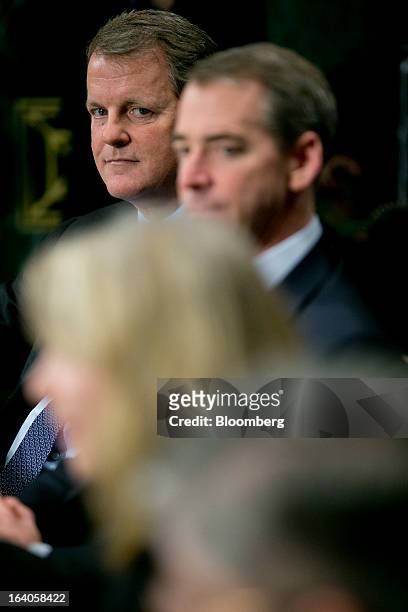 Douglas "Doug" Parker, chairman and chief executive officer of US Airways Group Inc., top to bottom, Thomas "Tom" Horton, chairman, president and...
