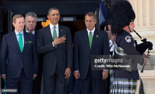 President Barack Obama is escorted by Irish Prime Minister Edna Kenny, Rep. Peter King , and U.S. Speaker of the House John Boehner as a bagpiper...