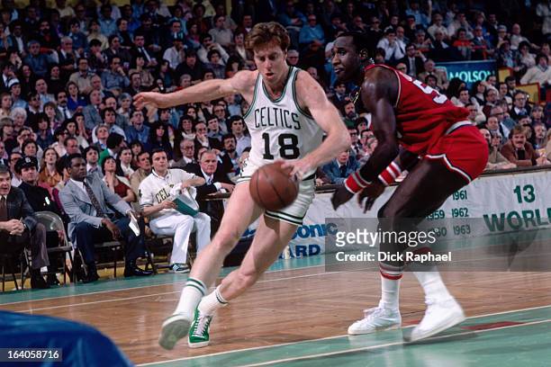 Dave Cowens of the Boston Celtics dribbles the ball against the Philadelphia 76ers during a game played circa 1980 at the Boston Garden in Boston,...