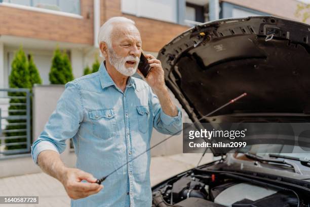 checking oil - smörjning bildbanksfoton och bilder