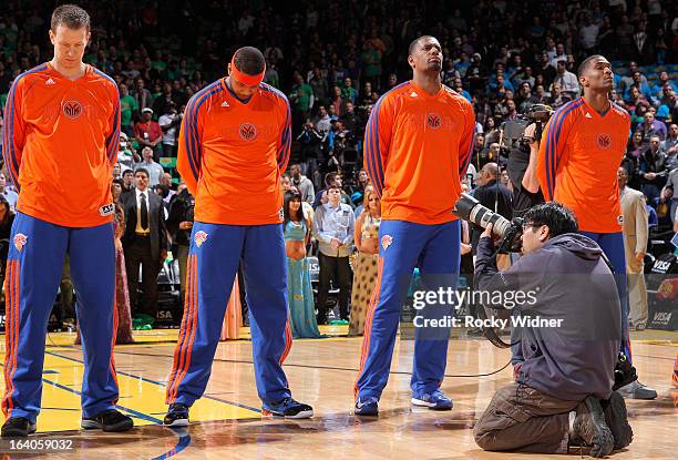 Steve Novak, Carmelo Anthony, Kurt Thomas and James White of the New York Knicks during the national anthem prior to the game against the Golden...