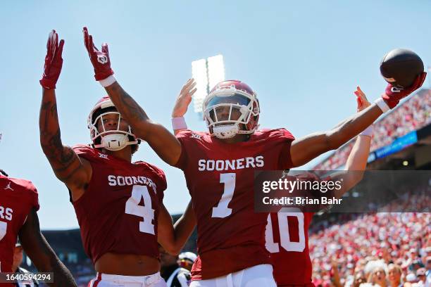 Wide receiver Jayden Gibson of the Oklahoma Sooners celebrates a 21-yard one-handed catch for a touchdown the Arkansas State Red Wolves in the third...