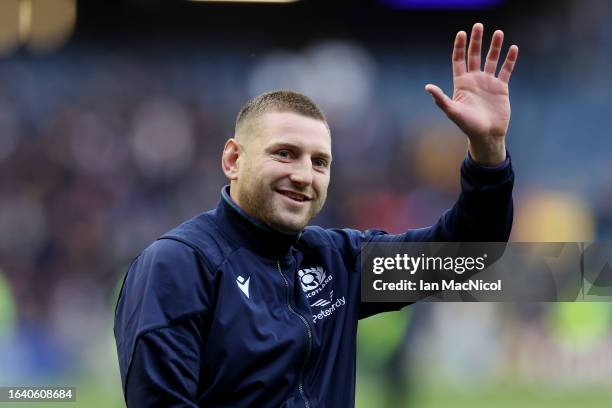 Finn Russell of Scotland waves to the fans at full-time following the Summer International match between Scotland and Georgia at BT Murrayfield...