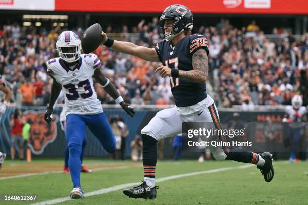 Tyson Bagent of the Chicago Bears rushes for a touchdown in the first half during a preseason game against the Buffalo Bills at Soldier Field on...