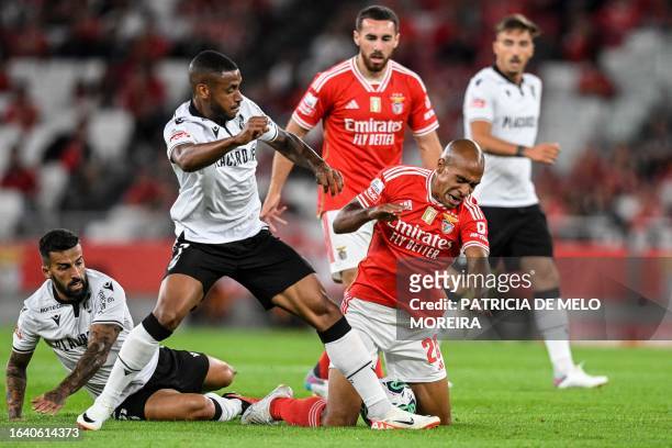 Benfica's Portuguese midfielder Joao Mario fights for the ball with Vitoria Guimaraes' Brazilian forward Andre Silva during the Portuguese league...