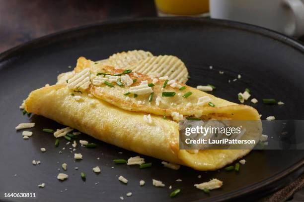 copycat buttery french omelette with potato chips from the bear tv show - sour cream stock pictures, royalty-free photos & images