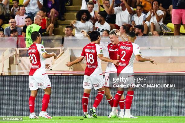 Monaco's Russian midfielder Aleksandr Golovin celebrates with teammates after scoring his team's second goal during the French L1 football match...