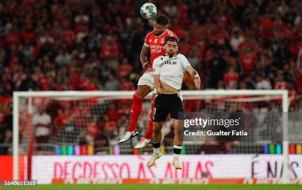 Nicolas Otamendi of SL Benfica with Jota Silva of Vitoria SC in action during the Liga Portugal Betclic match between SL Benfica and Vitoria SC at...