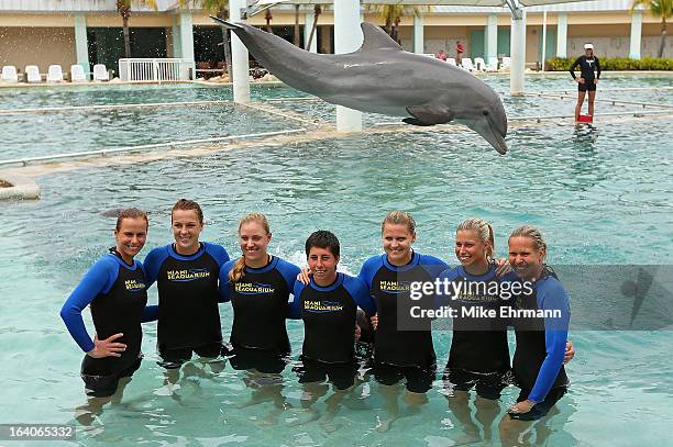 Varvara Lepchenko, Anastasia Pavlyuchenkova, Angelique Kerber, Carla Suarez Navarro, Lucie Safarova, and Lucie Hradecka pose with the dolphins at the...