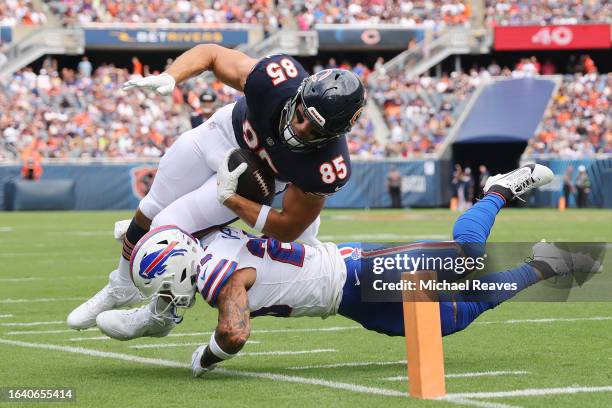 Taylor Rapp of the Buffalo Bills tackles Cole Kmet of the Chicago Bears during the first half of a preseason game at Soldier Field on August 26, 2023...