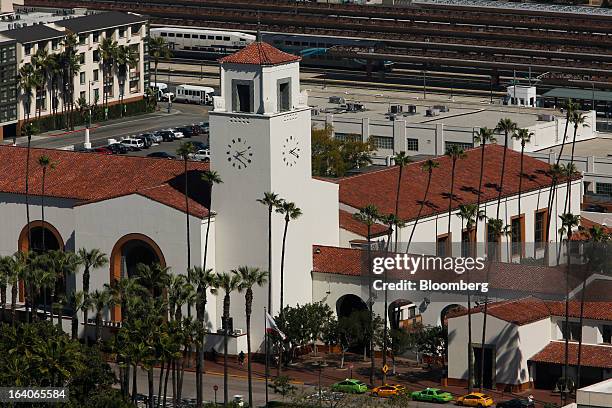 Metrolink commuter train pulls into Union Station as taxi cabs wait outside in Los Angeles, California, U.S., on Thursday, March 14, 2013. California...