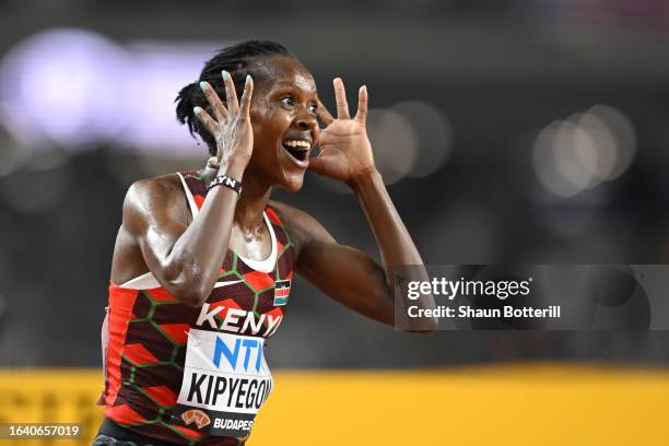 Faith Kipyegon of Team Kenya reacts to winning the Women's 5,000m Final during day eight of the World Athletics Championships Budapest 2023 at...