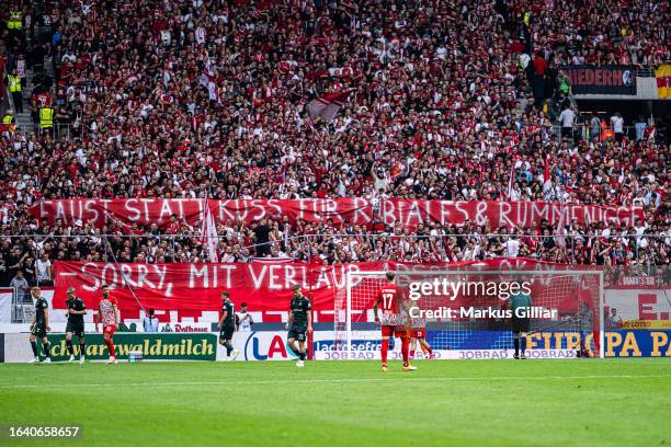 Freiburg fans display a banner "Faust statt Kuss für Rubiales & Rummenigge - Sorry, Mit Verlaub absolut okay" referring to Luis Rubiales' kiss and...