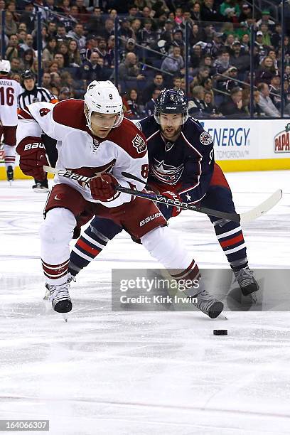 Matthew Lombardi of the Phoenix Coyotes and Colton Gillies of the Columbus Blue Jackets chase after a loose puck on March 16, 2013 at Nationwide...