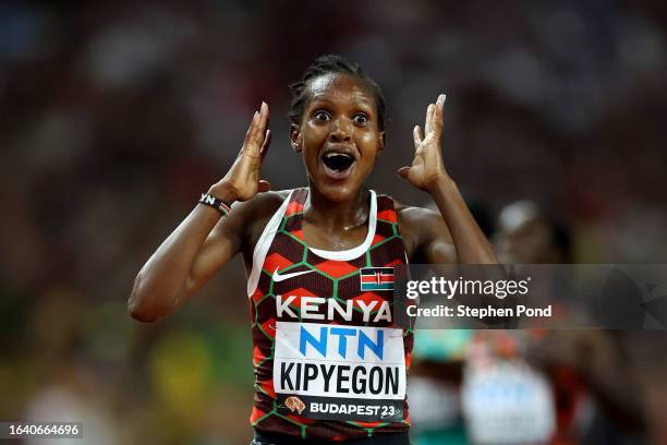 Faith Kipyegon of Team Kenya reacts after winning the Women's 5,000m Final during day eight of the World Athletics Championships Budapest 2023 at...