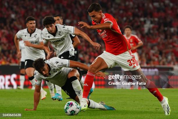 Petar Musa of SL Benfica with Jorge Fernandes of Vitoria SC in action during the Liga Portugal Betclic match between SL Benfica and Vitoria SC at...