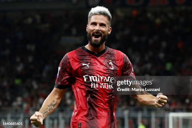 Olivier Giroud of AC Milan celebrates after scoring the team's second goal from a penalty kick during the Serie A TIM match between AC Milan and...