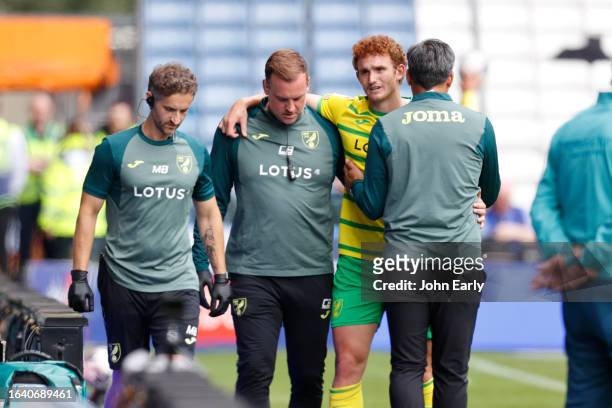 Josh Sargent of Norwich City is helped off after suffering an injury while scoring the opening goal during the Sky Bet Championship match between...