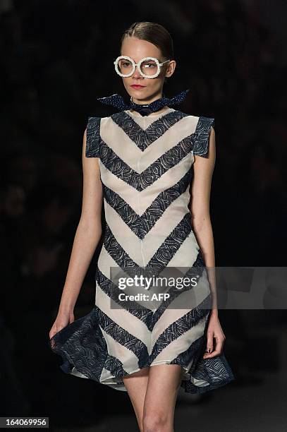 Model presents a creation by Acquastudio for Esther Bauman during the 2013 Summer collections of the Sao Paulo Fashion Week in Sao Paulo, Brazil, on...