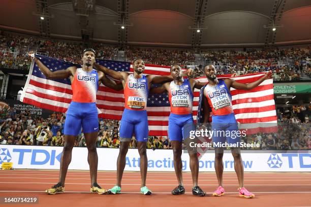 Fred Kerley, Noah Lyles Christian Coleman, and Brandon Carnes of Team United States celebrate winning the Men's 4x100m Relay Final during day eight...