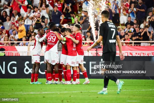 Monaco's players celebrate scoring their team's third goal during the French L1 football match between AS Monaco and RC Lens at the Louis II Stadium...