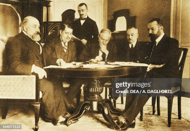 Giuseppe Volpi, Roumbeyoglou Fahreddin, Guido Fusinato, Mehemmed Naby Bey and Pietro Bertolini, Turkish and Italian peace delegations at Lausanne...