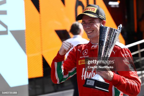 Frederik Vesti poses for a photo with trophy after he won Formula 2 race at Autodromo Nazionale di Monza in Monza, Italy on September 2, 2023.