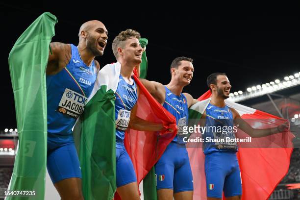 Silver medalists Lamont Marcell Jacobs, Roberto Rigali, Filippo Tortu, and Lorenzo Patta of Team Italy celebrate after the Men's 4x100m Relay Final...