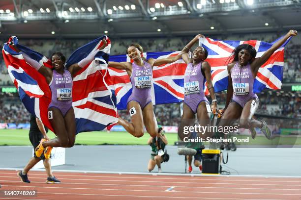 Asha Philip, Imani Lansiquot, Bianca Williams and Daryll Neita of Team Great Britain celebrate after the Women's 4x100m Relay Final during day eight...