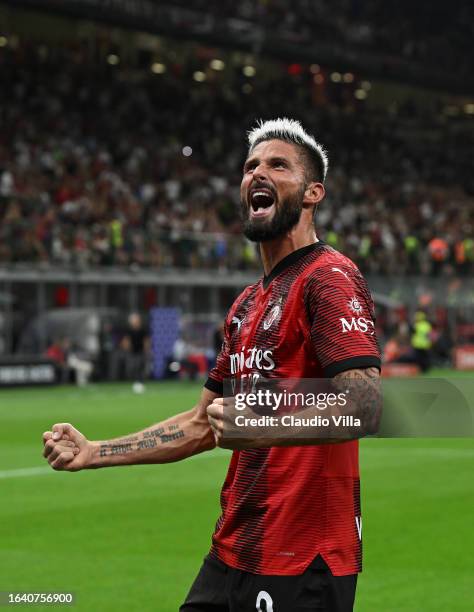 Olivier Giroud of AC Milan celebrates after scoring the goal during the Serie A TIM match between AC Milan and Torino FC at Stadio Giuseppe Meazza on...