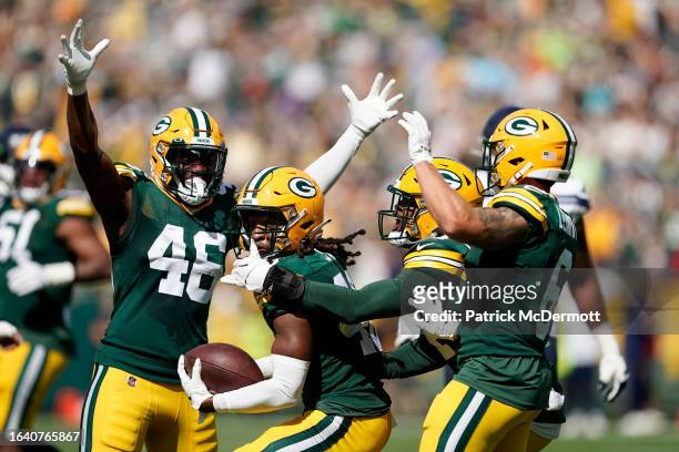 Benny Sapp III of the Green Bay Packers celebrates with his teammates after making an interception in the fourth quarter against the Seattle Seahawks...