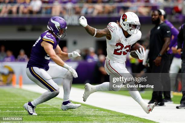 Corey Clement of the Arizona Cardinals is pushed out of bounds by Wilson Huber of the Minnesota Vikings in the second half of a preseason game at...