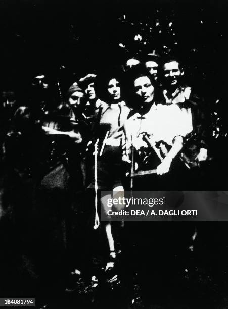 Women and men of a partisan group on the Plateau of the Seven Communities . World War II, Resistance, Italy, 20th century. Vicenza, Museo Del...