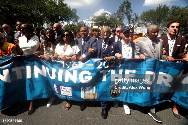 The Rev. Al Sharpton, Martin Luther King III, his wife Arndrea King and daughter Yolanda King, and other civil rights leaders participate in the 60th...