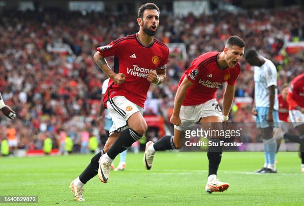 Manchester United player Bruno Fernandes celebrates after scoring the third United goal during the Premier League match between Manchester United and...