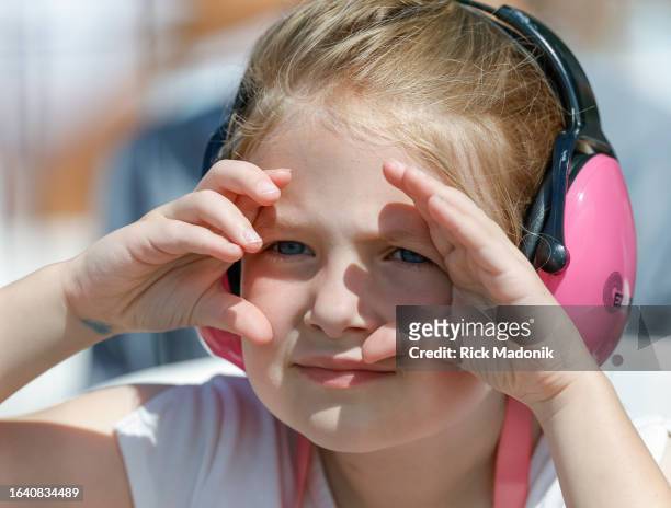 Child watches the show and has ear protection in place. The 74th edition of the Canadian International Air Show on the concluding weekend of the CNE....