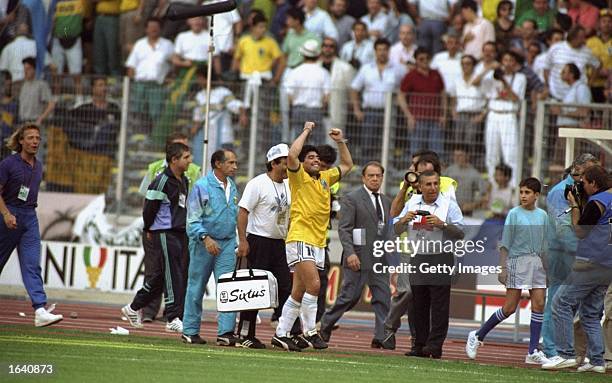 Diego Maradona of Argentina celebrates after the World Cup match against Brazil at the Delle Alpi Stadium in Turin, Italy. Argentina won the match...