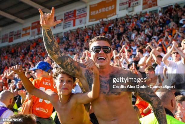 Blackpool fans celebrate their late winner during the Sky Bet League One match between Blackpool and Wigan Athletic at Bloomfield Road on September...