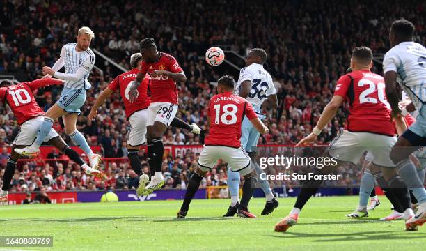 Willy Boly of Notts Forest heads the second Forest goal during the Premier League match between Manchester United and Nottingham Forest at Old...